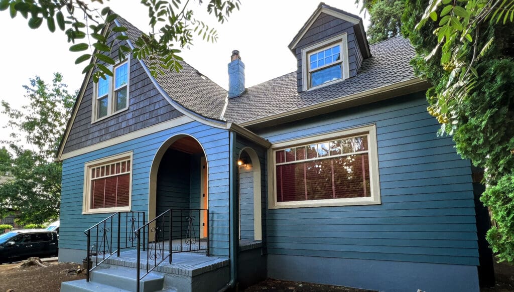A new blue siding job on an older home to help illustrate how to increase home value by $50k